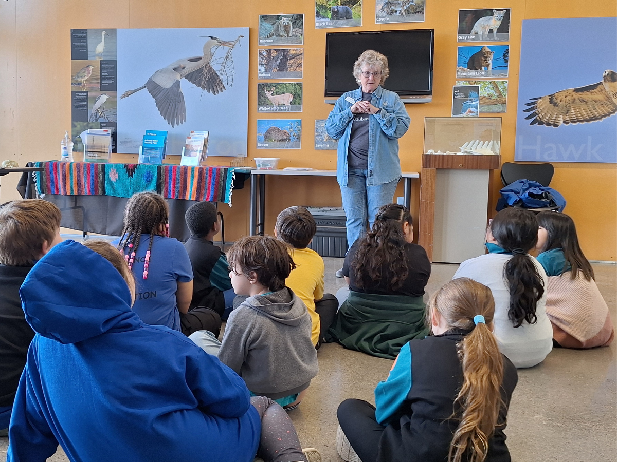 Diana Luscher guiding students through their field trip experiences.