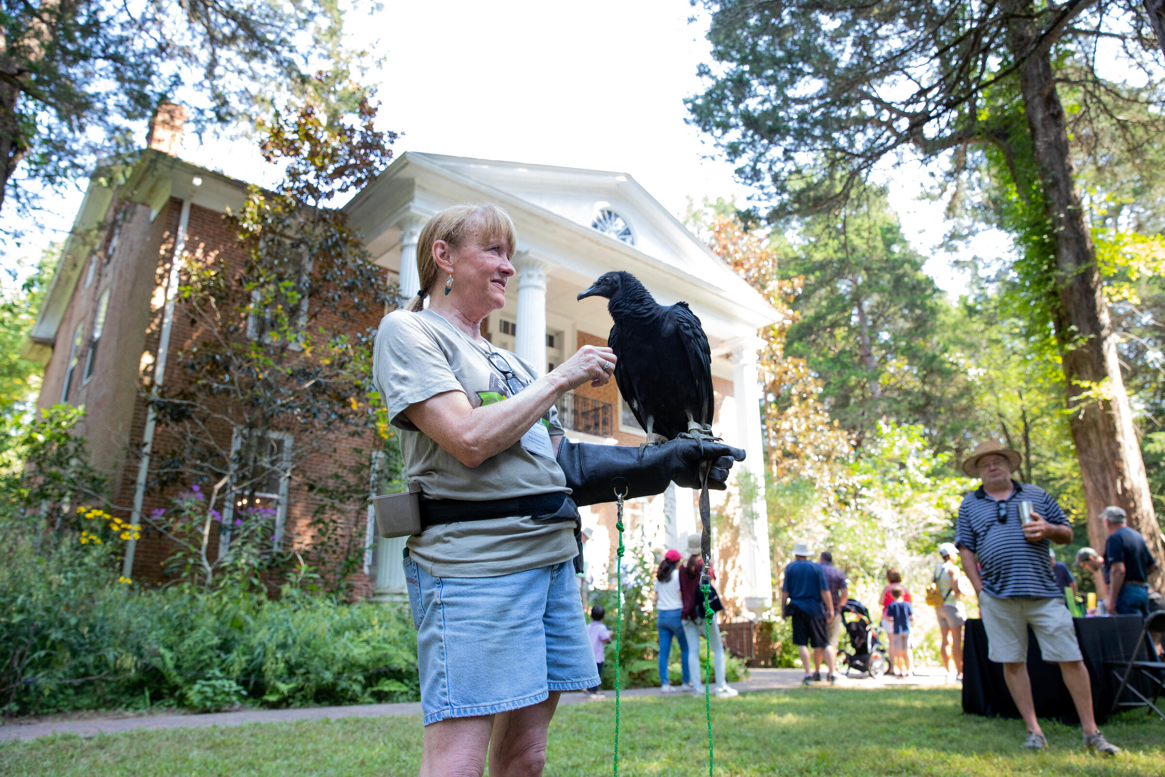 Mississippi Wildlife Foundation volunteer educates festival goers about black vultures.